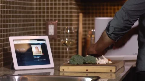 Making Dinner and Using Tablet Computer - iPad touchscreen Stock Footage 47780975