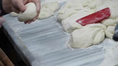 Making dough for bread in a busy kitchen Видео 337059536