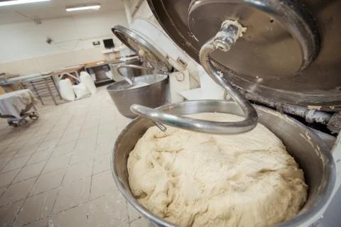 Making dough for bread in a kneader in a bakery Stock Photos
