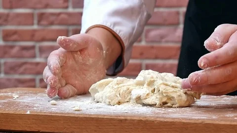 Making dough, kneating in the kitchen Stock Footage 74948084