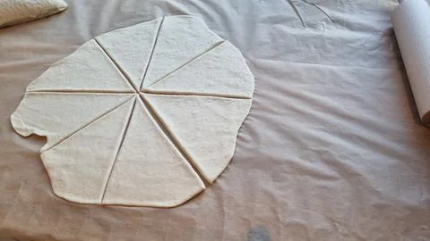Making dough shapes for baking in a kitchen setting at home Stock Photos