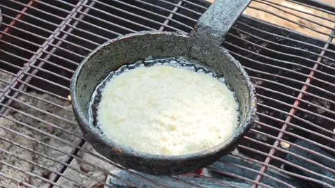 Making draniki in a rustic kitchen using simple tools and fresh potatoes Stock Footage 340462609