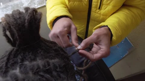 Making Dreadlocks Stock Footage 171622675