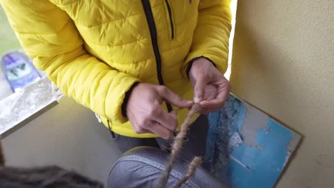 Making Dreadlocks Stock Footage 171622697