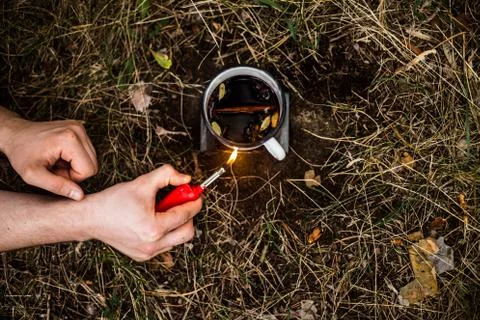 Making a drink outdoors in an Esbit oven Stock Photos