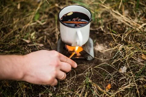 Making a drink outdoors in an Esbit oven Stock Photos
