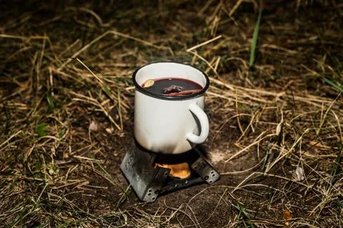 Making a drink outdoors in an Esbit oven Stock Photos