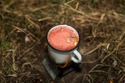 Making a drink outdoors in an Esbit oven Stock Photos