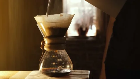 Making drip coffee. Brewed coffee dripping in glass coffee pot Stock Footage 141451699