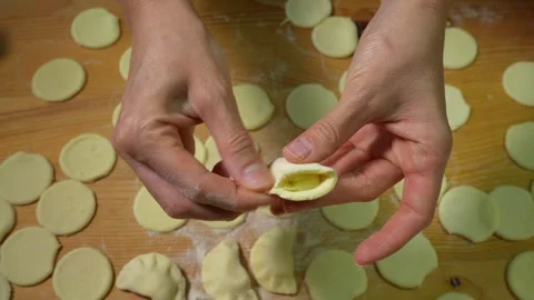 Making Dumplings By Hand At Home. Chef Hands Forming Small Handmade Dumplings Stock Footage 317039299