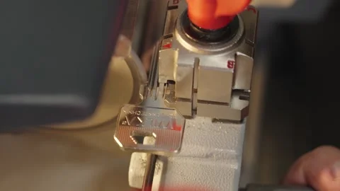 Making duplicate keys for a door lock. Warsaw, Poland - april 19, 2024 Stock Footage 273144171
