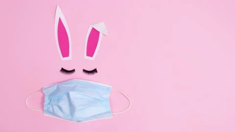 Making Easter bunny with face mask and blinking eye lashes. Stop motion flat lay Stock Footage 150071168