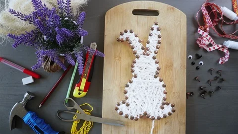 Making Easter Bunny Of White Yarn. Animated Cartoon Stock Footage 128277406