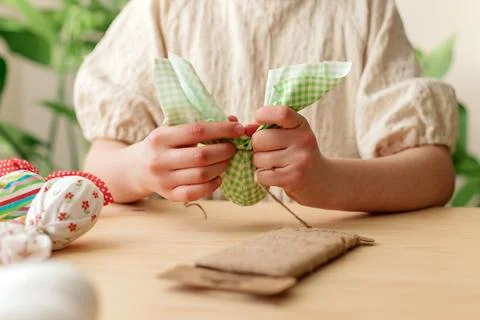 Making Easter decorations. Close-up of a girl's hands making textile easter egg Stock Photos
