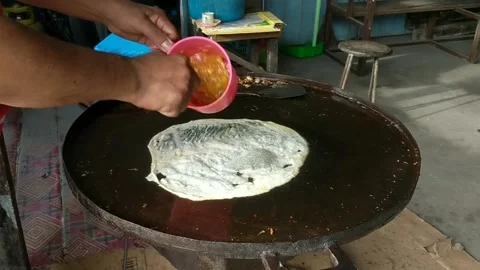 Making egg martabak Stock Footage 229447933