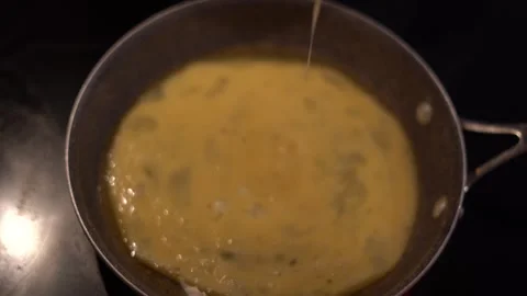 Making eggs, cooking eggs, scrambled eggs, breakfast Stock Footage 262183810