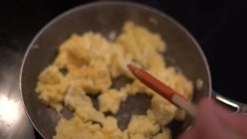 Making eggs, cooking eggs, scrambled eggs, breakfast Stock Footage 262184005