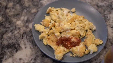 Making eggs, cooking eggs, scrambled eggs, breakfast Stock Footage 262184266