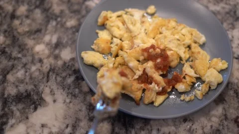 Making eggs, cooking eggs, scrambled eggs, breakfast Stock Footage 262184269