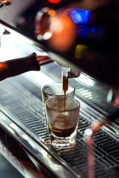 Making espresso coffee close up detail with modern machine Stock Photos