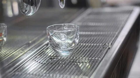 Making espresso coffee in a coffee machine and pouring to cup. Stock Footage 86259593