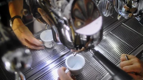 Making espresso coffee in a coffee machine and pouring to cup. Stock Footage 86259758