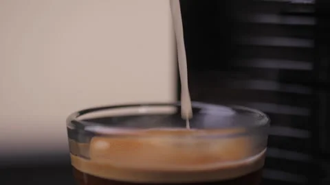 Making espresso coffee in coffee machine slow motion Stock Footage 148337714