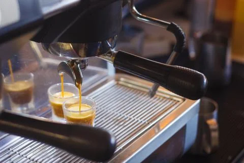 Making espresso in the coffee machine. Stock Photos