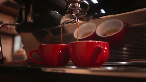 Making espresso coffee pouring  using two spout portafilter on espresso machine. Stock Footage 147103391