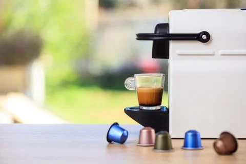 Making espresso. Espresso coffee maker on a wooden table. Blurred background, Foto stock