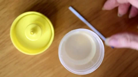 Making express pregnancy test with a test stick and urine sample. Stock Footage 230914418