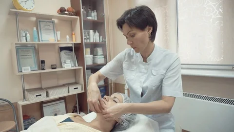 Making face massage with fingers Stock Footage 87825148