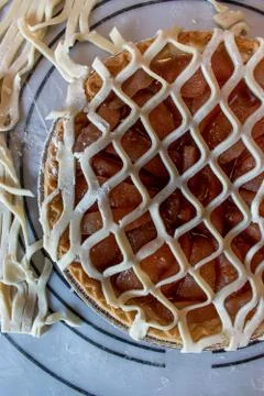 Making fancy pie dough lattice work for pie crust top Stock Photos