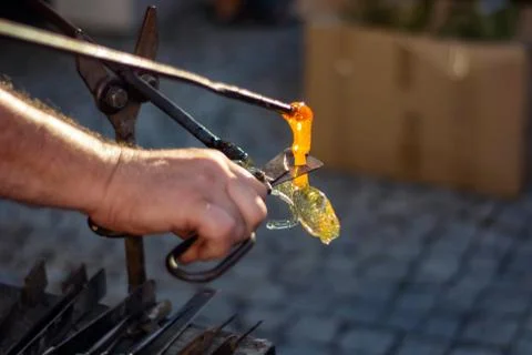 Making figurines from glass, just pulled out of the oven Stock Photos