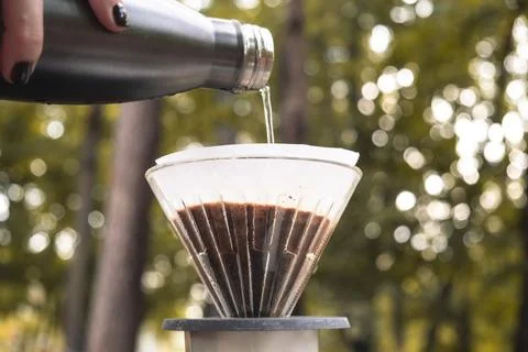 Making filter coffee. Coffee in the car. Autumn forest. Stock Photos