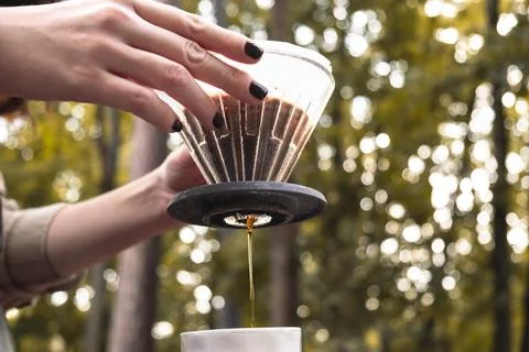 Making filter coffee. Coffee in the car. Autumn forest. Stock Photos