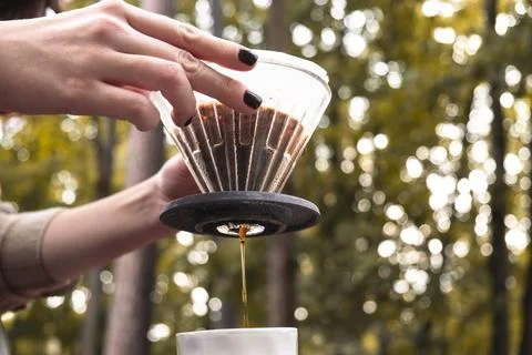 Making filter coffee. Coffee in the car. Autumn forest. Stock Photos