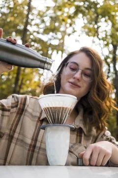 Making filter coffee. Coffee in the car. Autumn forest. Stock Photos