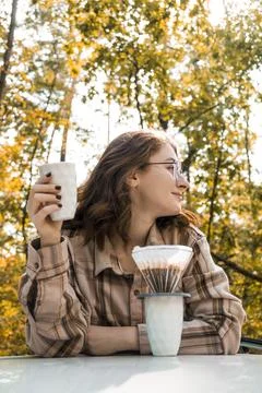 Making filter coffee. Coffee in the car. Autumn forest. Stock Photos