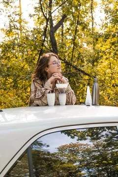 Making filter coffee. Coffee in the car. Autumn forest. Stock Photos