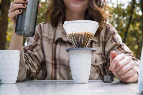 Making filter coffee. To go. Coffee in the car. Stock Photos
