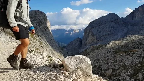 Making the final step of a hike in the astonishingly beautiful Dolomites. Stock Footage 97718164