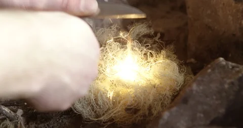 Making fire with a flint stick Stock Footage 90404140