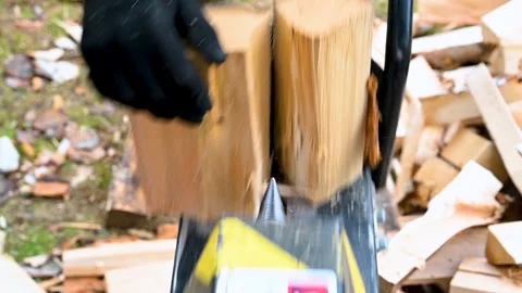 Making fire woods with splitting machine. Stock Footage 246740732