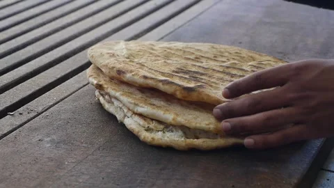 Making flatbread at a local market Stock Footage 343480790