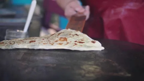 Making flatbread in an outdoor kitchen Stock Footage 340057809