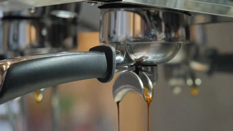 Making Fresh coffee going out from a coffee espresso machine. Shoot on Digital Video stock 92229870