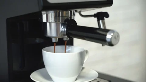 Making fresh espresso coffee by coffee machine Stock Footage 100579548