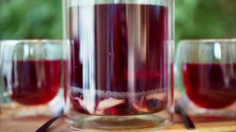 Making of fresh fruit tea in a transparent glass teapot, a refreshing drink.. Stock Footage 339214207
