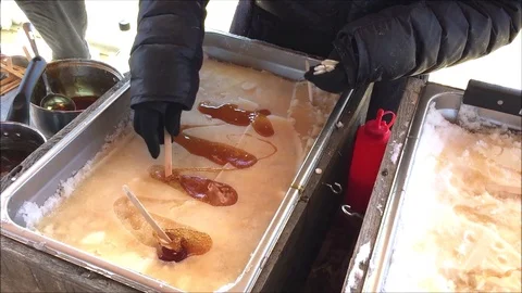 Making fresh maple syrup taffy lollipops 動画素材 104123702